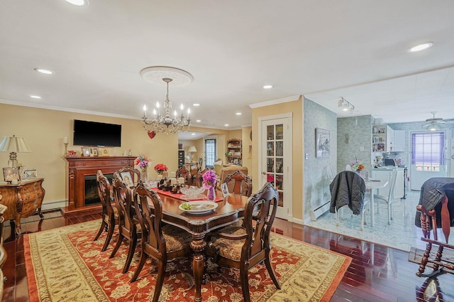 10 Harrison St, Brentwood, NY 11717 - dining room with crown molding, wood finished floors, recessed lighting, a chandelier, and baseboard heating