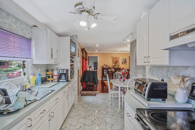 10 Harrison St, Brentwood, NY 11717 - kitchen featuring electric stove, light countertops, light marble finish flooring, white cabinetry, and a ceiling fan