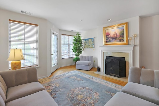 23 Bridge Ln Unit 23, Haverstraw, NY 10927 - living room featuring wood finished floors, a fireplace with flush hearth, and recessed lighting