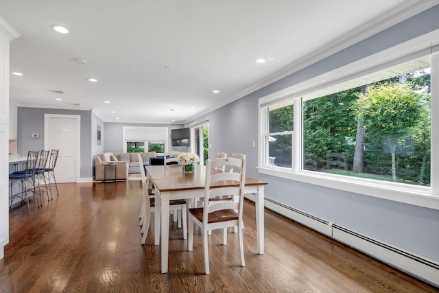 14 Ridge Dr E, Roslyn, NY 11576 - dining room featuring a baseboard heating unit, crown molding, dark wood-style floors, and recessed lighting