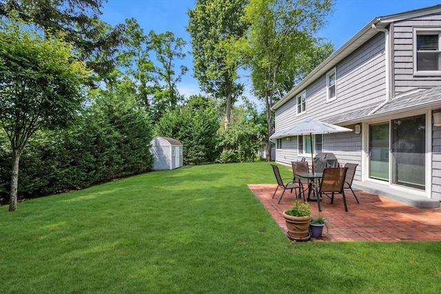 14 Ridge Dr E, Roslyn, NY 11576 - view of grassy yard featuring a patio and a storage shed