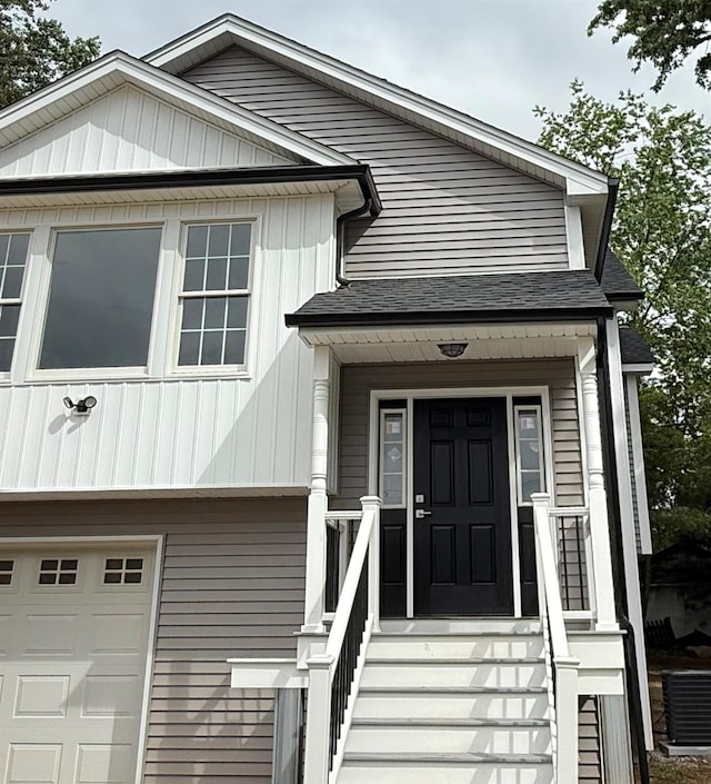 47 Sheridan Ave, Congers, NY 10920 - view of front of property with a garage, roof with shingles, and board and batten siding