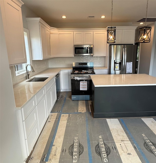 47 Sheridan Ave, Congers, NY 10920 - kitchen with stainless steel appliances, light countertops, backsplash, and recessed lighting
