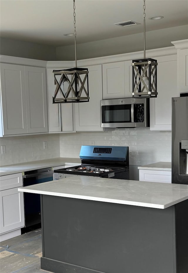 47 Sheridan Ave, Congers, NY 10920 - kitchen with appliances with stainless steel finishes, light countertops, pendant lighting, and tasteful backsplash
