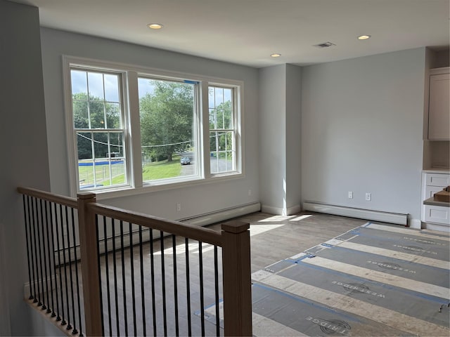 47 Sheridan Ave, Congers, NY 10920 - unfurnished living room with baseboard heating and recessed lighting
