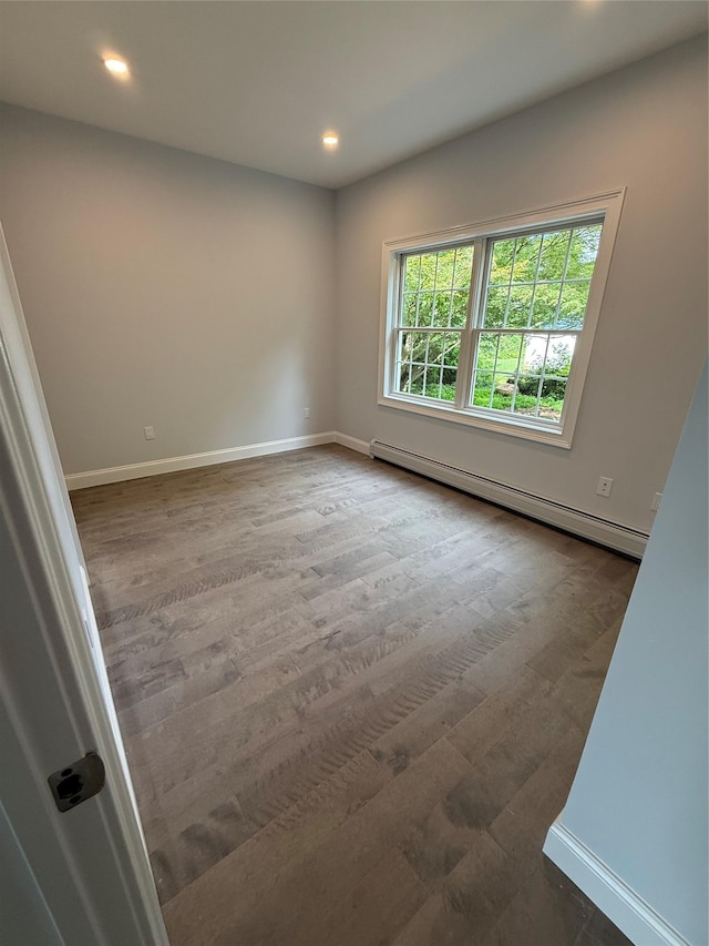 47 Sheridan Ave, Congers, NY 10920 - empty room featuring a baseboard radiator, recessed lighting, and wood finished floors