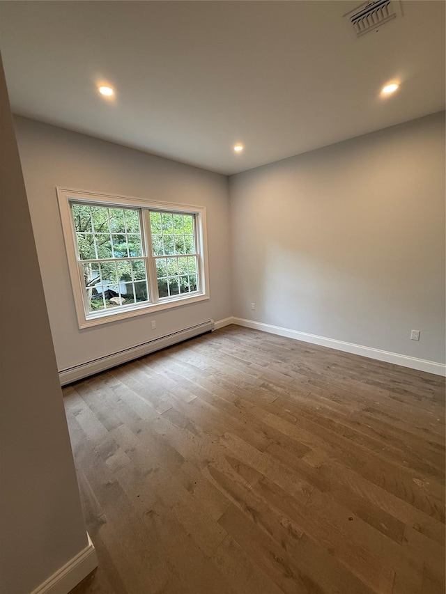 47 Sheridan Ave, Congers, NY 10920 - empty room featuring baseboard heating, wood finished floors, and recessed lighting