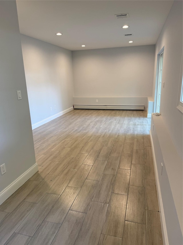 47 Sheridan Ave, Congers, NY 10920 - unfurnished room featuring a baseboard heating unit, light wood-style floors, and recessed lighting
