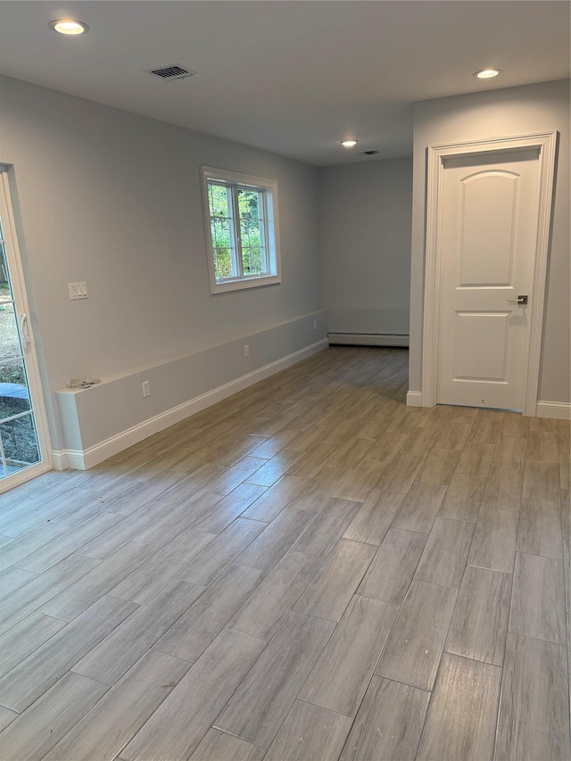 47 Sheridan Ave, Congers, NY 10920 - spare room with baseboard heating, light wood-style flooring, and recessed lighting