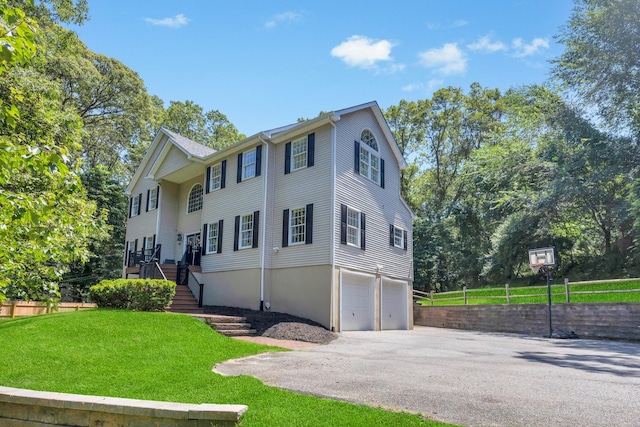 212A Lower Sheep Pasture Rd, East Setauket, NY 11733 - view of front facade featuring a garage, a front yard, driveway, and stairs