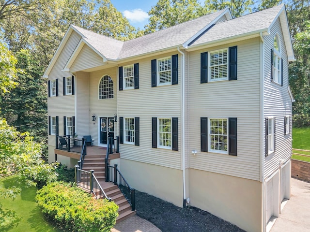 212A Lower Sheep Pasture Rd, East Setauket, NY 11733 - view of front of house with roof with shingles