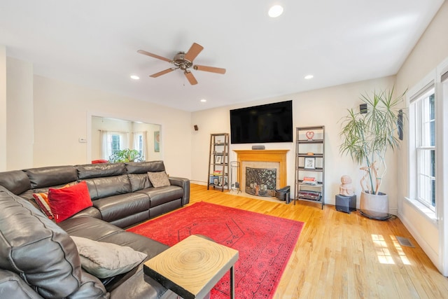 212A Lower Sheep Pasture Rd, East Setauket, NY 11733 - living area featuring healthy amount of natural light, ceiling fan, light wood finished floors, a fireplace, and recessed lighting