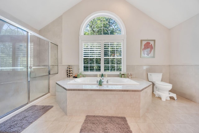 212A Lower Sheep Pasture Rd, East Setauket, NY 11733 - bathroom with tile patterned flooring, a garden tub, a shower stall, high vaulted ceiling, and wainscoting