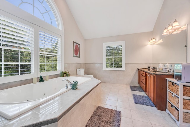 212A Lower Sheep Pasture Rd, East Setauket, NY 11733 - full bath with plenty of natural light, vanity, a tub with jets, high vaulted ceiling, and wainscoting