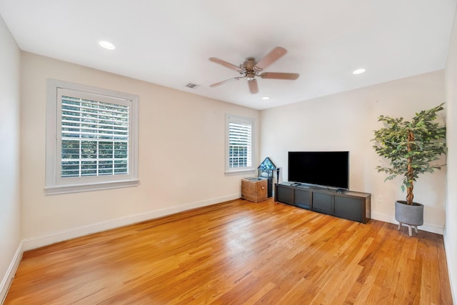 212A Lower Sheep Pasture Rd, East Setauket, NY 11733 - unfurnished living room with a ceiling fan, light wood finished floors, and recessed lighting