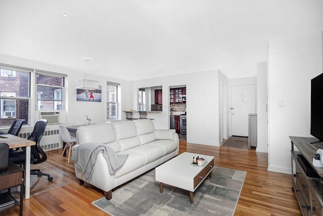 105-25 67th Rd Unit 5G, Forest Hills, NY 11375 - living room with radiator and wood finished floors