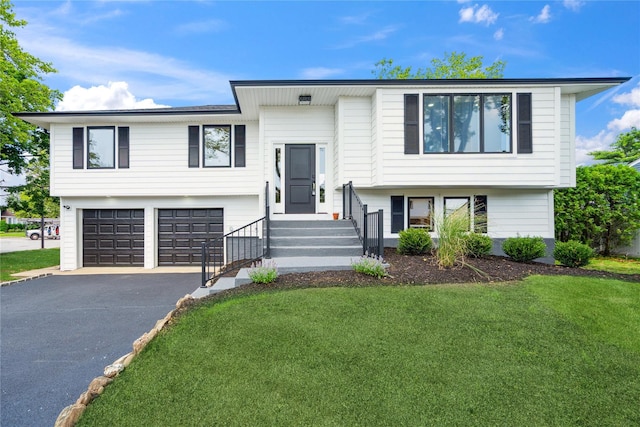 43 Acorn Ln, Plainview, NY 11803 - bi-level home with asphalt driveway, a garage, and a front lawn