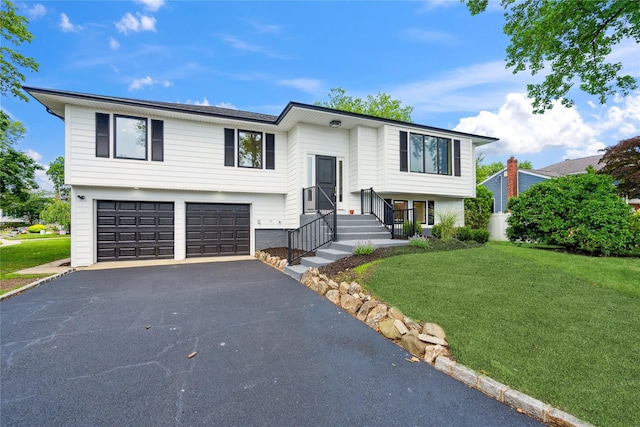 43 Acorn Ln, Plainview, NY 11803 - bi-level home featuring driveway, a garage, and a front lawn