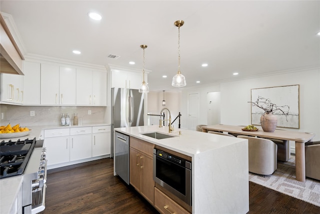 43 Acorn Ln, Plainview, NY 11803 - kitchen featuring stainless steel appliances, recessed lighting, ornamental molding, dark wood finished floors, and decorative backsplash
