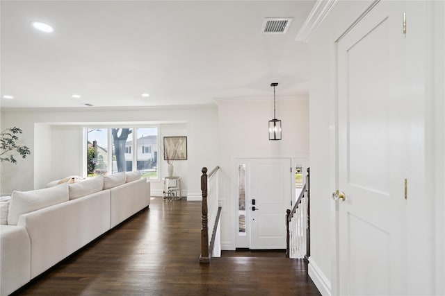 43 Acorn Ln, Plainview, NY 11803 - entrance foyer with ornamental molding, dark wood-type flooring, and recessed lighting