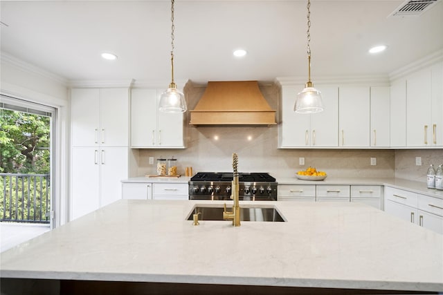 43 Acorn Ln, Plainview, NY 11803 - kitchen with custom exhaust hood, a kitchen island with sink, pendant lighting, decorative backsplash, and white cabinets