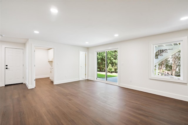 43 Acorn Ln, Plainview, NY 11803 - unfurnished living room with dark wood finished floors and recessed lighting