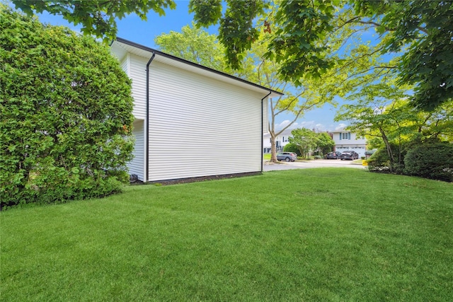43 Acorn Ln, Plainview, NY 11803 - view of side of home with a yard
