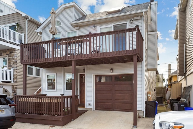101 Connecticut Ave, Long Beach, NY 11561 - view of front of property featuring roof with shingles, concrete driveway, and an attached garage
