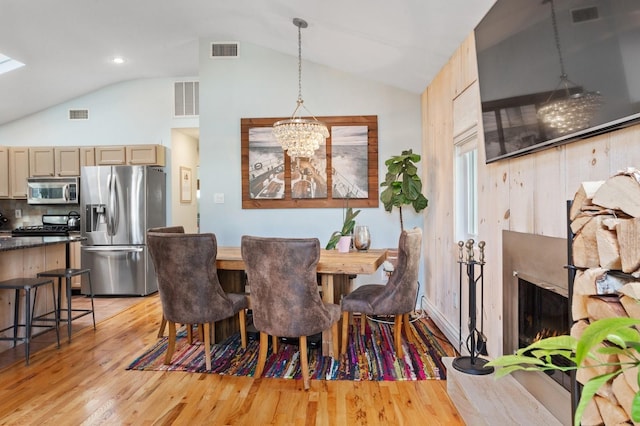 101 Connecticut Ave, Long Beach, NY 11561 - dining room featuring lofted ceiling, light wood-style floors, and a chandelier