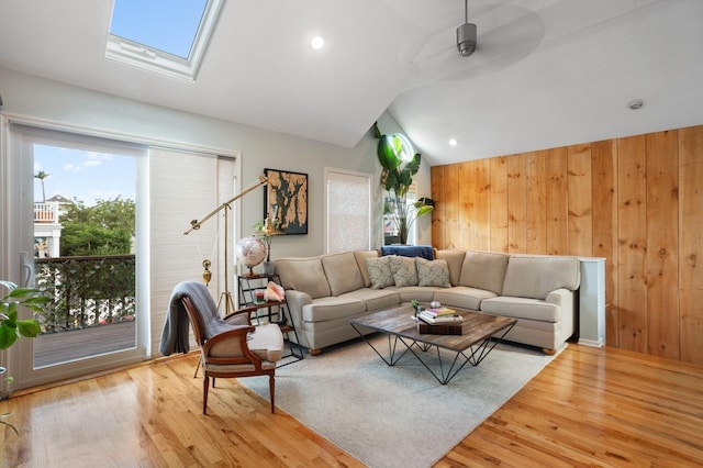 101 Connecticut Ave, Long Beach, NY 11561 - living area featuring vaulted ceiling, plenty of natural light, a skylight, wood finished floors, and ceiling fan