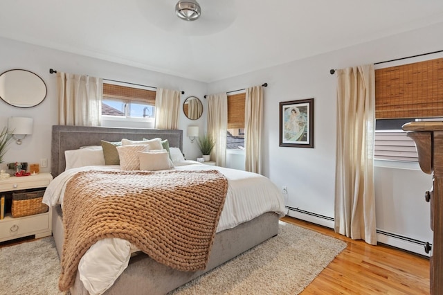 101 Connecticut Ave, Long Beach, NY 11561 - bedroom featuring a baseboard heating unit and light wood finished floors