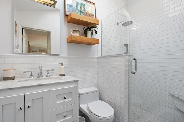 101 Connecticut Ave, Long Beach, NY 11561 - bathroom featuring a tile shower, tile walls, vanity, and wainscoting
