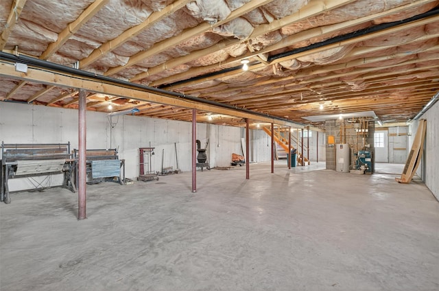 81 Hambletonian Rd, Chester, NY 10918 - unfinished below grade area with electric water heater, stairway, and a heating unit