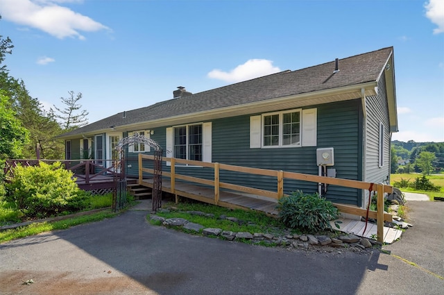 81 Hambletonian Rd, Chester, NY 10918 - view of front facade with a deck and a chimney