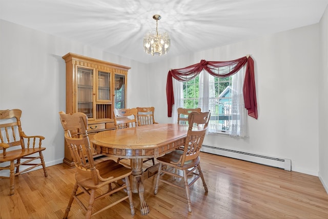 81 Hambletonian Rd, Chester, NY 10918 - dining space featuring a baseboard radiator, a chandelier, and light wood finished floors