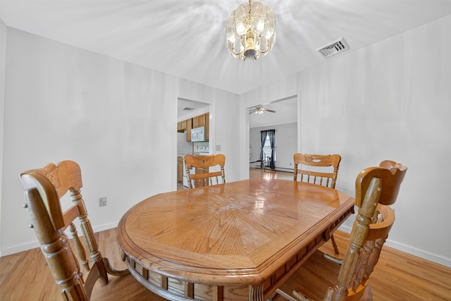 81 Hambletonian Rd, Chester, NY 10918 - dining room featuring light wood-style floors, a chandelier, and ceiling fan