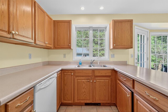81 Hambletonian Rd, Chester, NY 10918 - kitchen featuring white dishwasher, light tile patterned floors, light countertops, recessed lighting, and brown cabinets