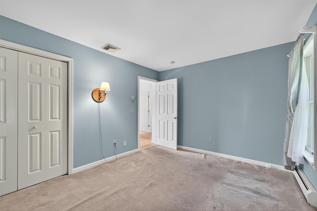 81 Hambletonian Rd, Chester, NY 10918 - unfurnished bedroom featuring baseboard heating, carpet, and a closet
