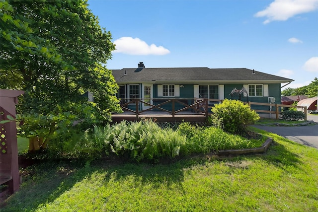 81 Hambletonian Rd, Chester, NY 10918 - ranch-style house with a chimney, a wooden deck, and a front lawn