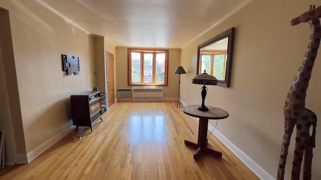 61-56 70th St, Middle Village, NY 11379 - entrance foyer with radiator, light wood-type flooring, crown molding, and a wall mounted AC