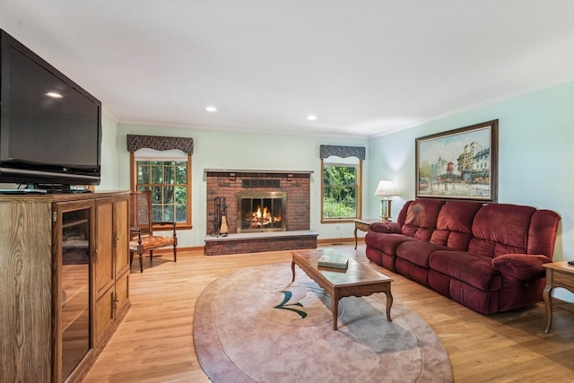 4 Springview Ct, East Patchogue, NY 11772 - living area featuring crown molding, light wood finished floors, a fireplace, and recessed lighting