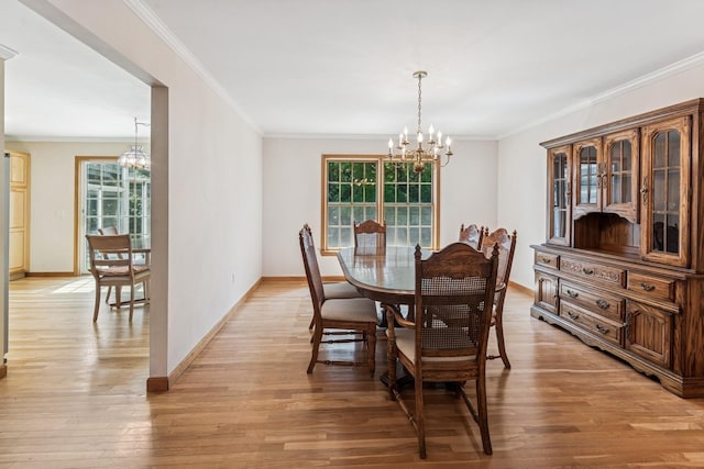4 Springview Ct, East Patchogue, NY 11772 - dining area with a chandelier, ornamental molding, and light wood-style flooring
