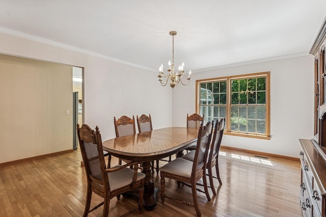 4 Springview Ct, East Patchogue, NY 11772 - dining space with a chandelier, light wood-style flooring, and ornamental molding