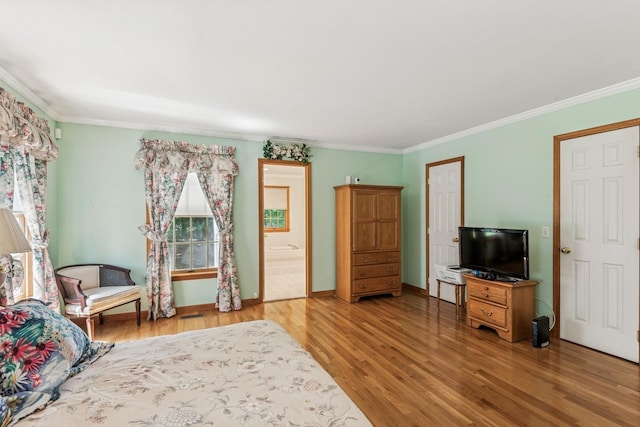 4 Springview Ct, East Patchogue, NY 11772 - living area featuring wood finished floors and crown molding