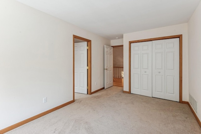 4 Springview Ct, East Patchogue, NY 11772 - unfurnished bedroom with light colored carpet and a closet