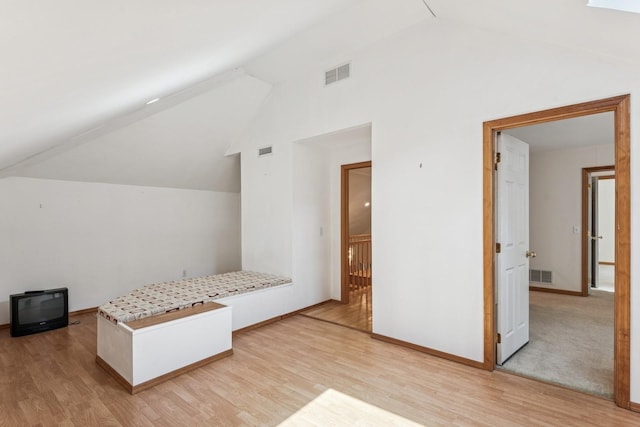 4 Springview Ct, East Patchogue, NY 11772 - unfurnished bedroom with light wood-style floors and high vaulted ceiling
