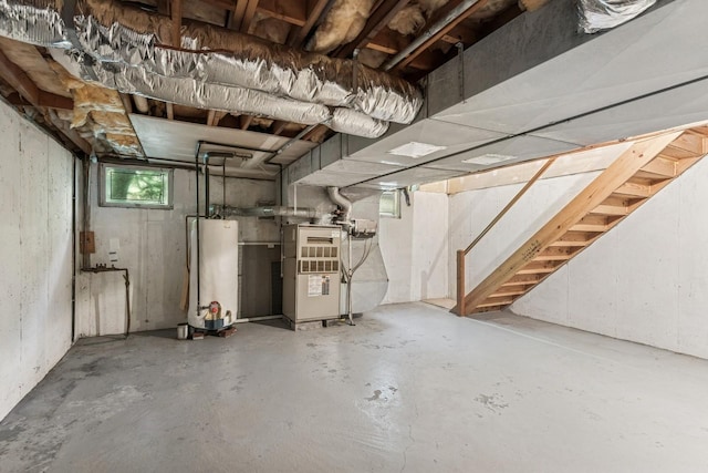 4 Springview Ct, East Patchogue, NY 11772 - below grade area with gas water heater, heating unit, and stairs