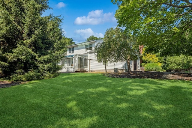 4 Springview Ct, East Patchogue, NY 11772 - rear view of house with a lawn and entry steps