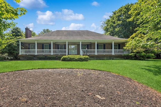 4 Springview Ct, East Patchogue, NY 11772 - farmhouse-style home featuring a porch, a chimney, brick siding, and a front lawn