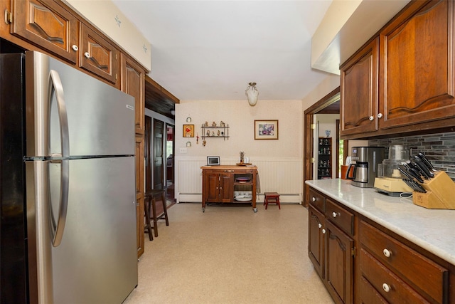 110 Read Rd, Red Hook, NY 12571 - kitchen with freestanding refrigerator, a wainscoted wall, light countertops, tasteful backsplash, and a baseboard heating unit